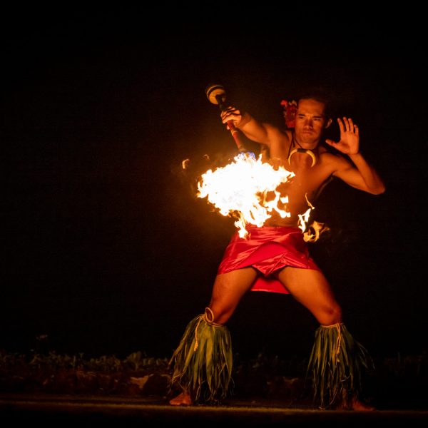a person standing in front of a sunset