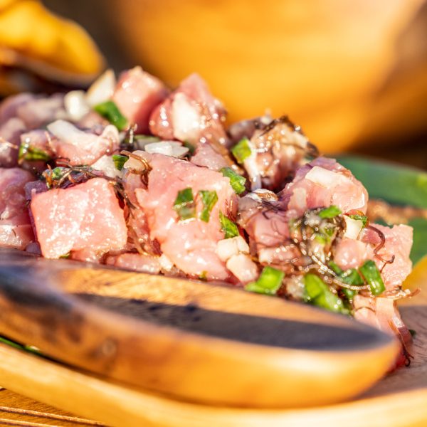 a slice of pizza sitting on top of a wooden table