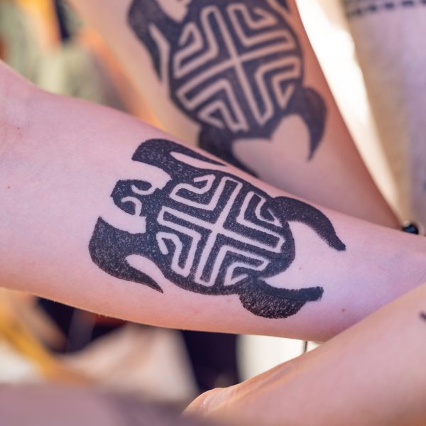 a close up of a tattoo on his feet