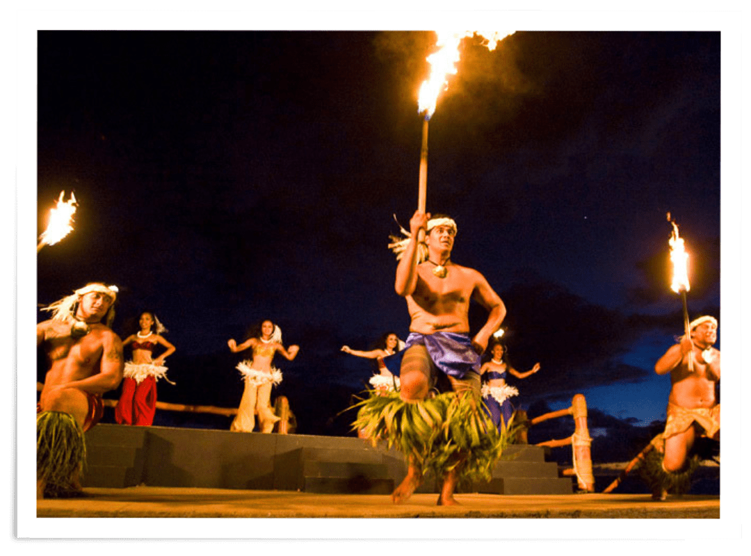 a group of people standing around a fire